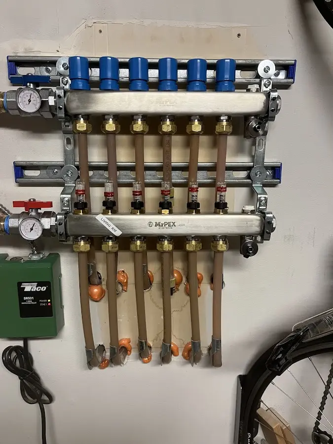 Plumber performing Water Heater Repair at a residential property in Greenwich